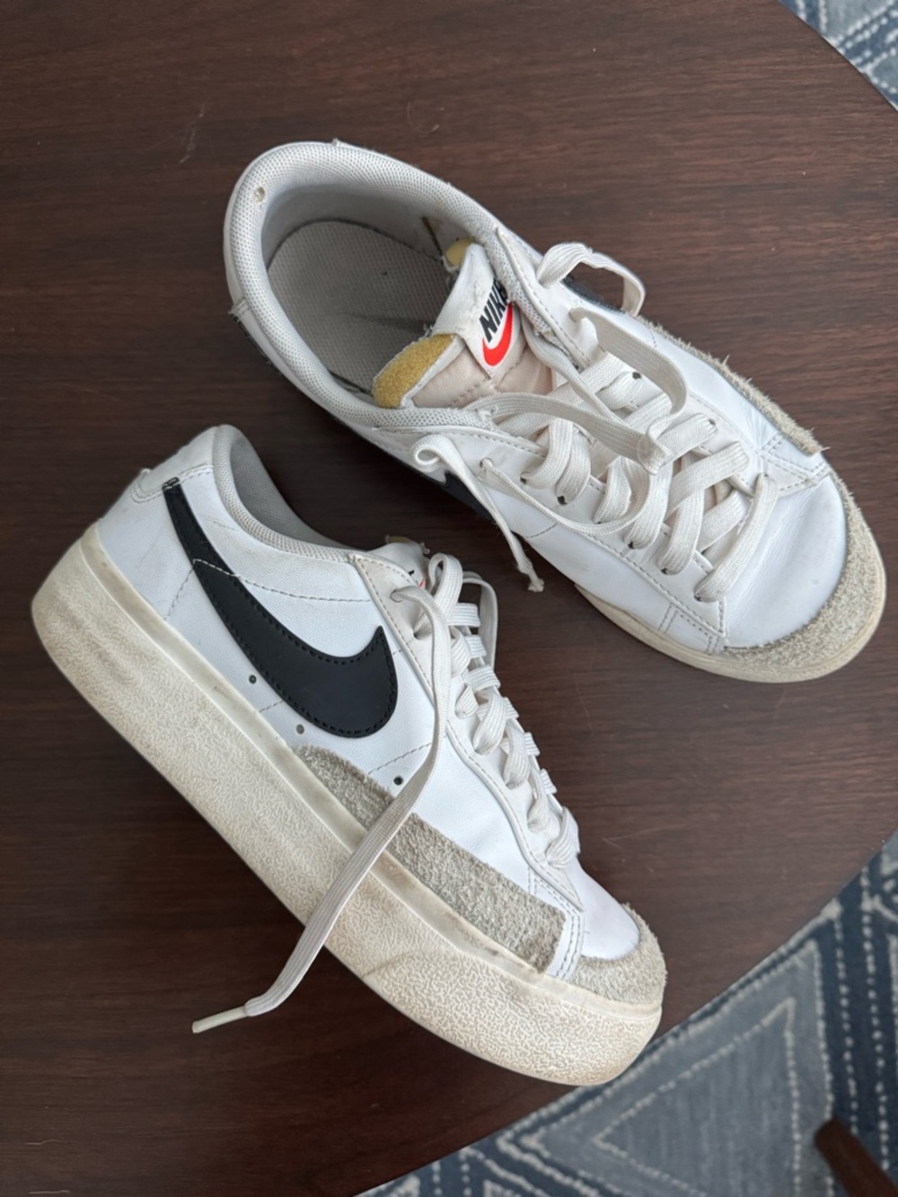 Nike White Sneakers with Black Swoosh and Cream Accents